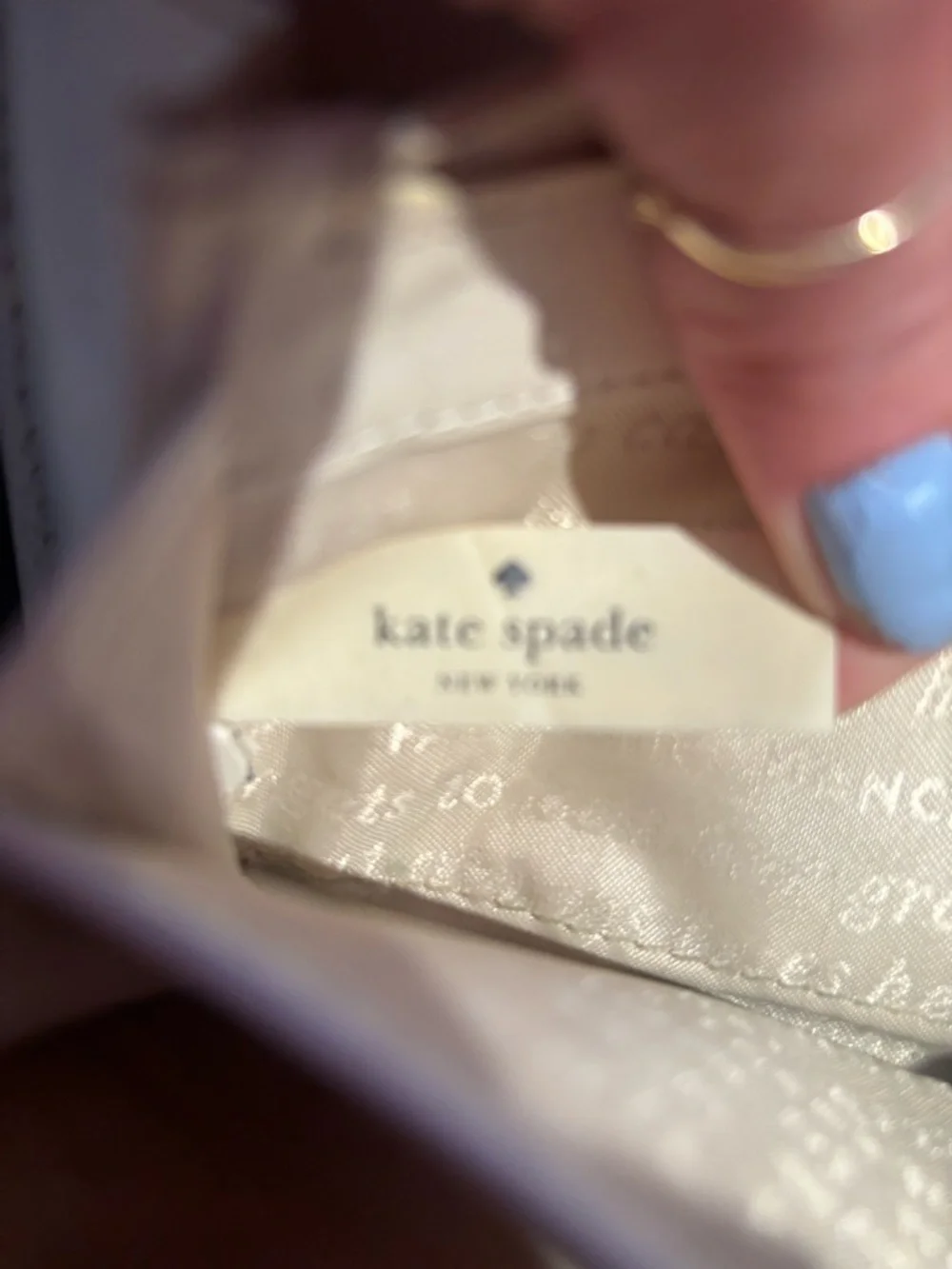 grey Kate Spade Beacon Court patent leather wallet